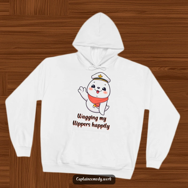 Funny Giggling Seal First Mate Hoodie, a seal waves with delight, bringing warmth and humor, a comfortable and funny gift for sailors.